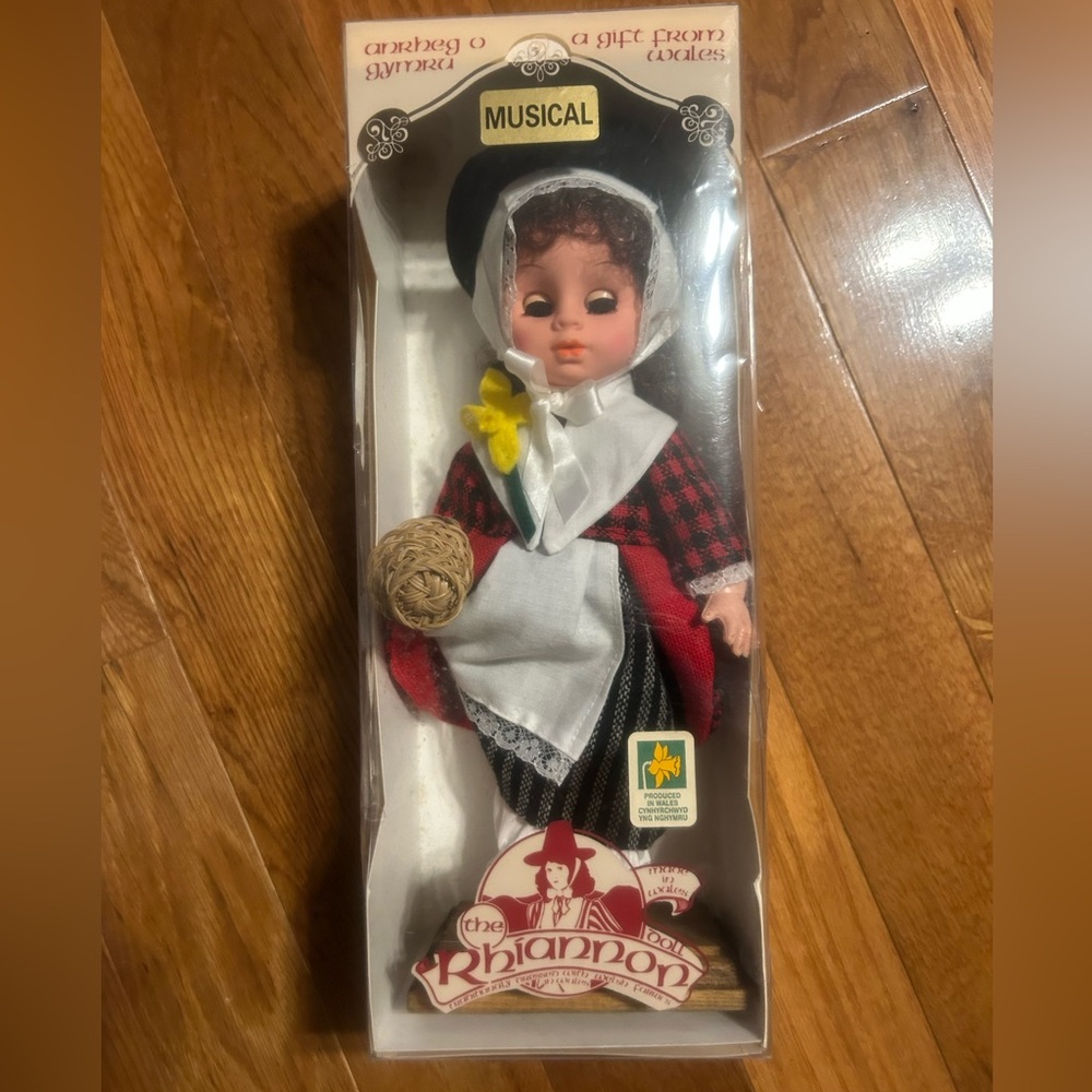 Musical doll from Wales. Comes with stand. Has been stored in the original box.